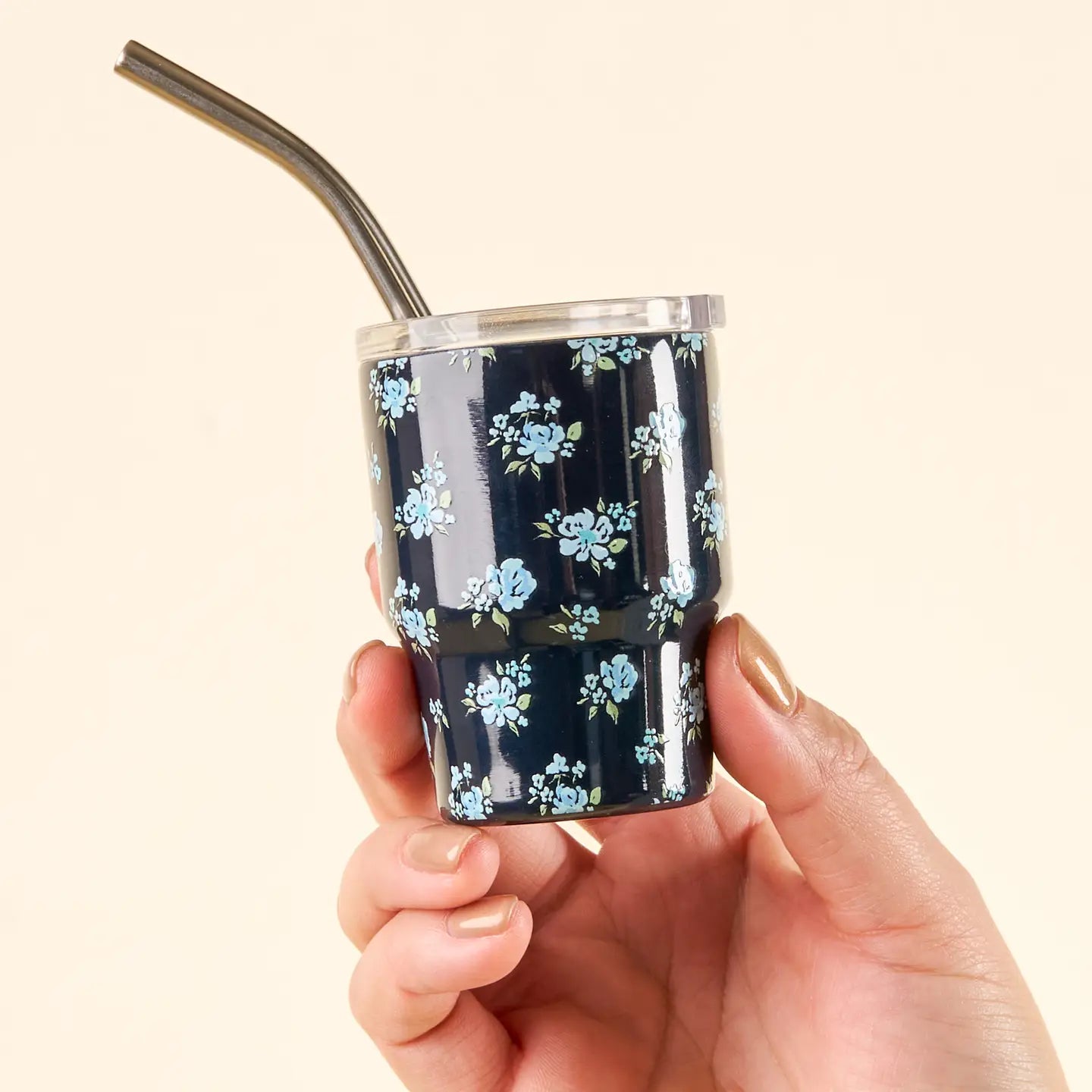 hand holding Dainty Navy Floral tiny tumbler