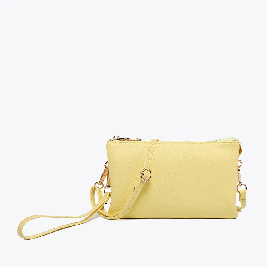 pastel yellow christine wristlet crossbody on a white background