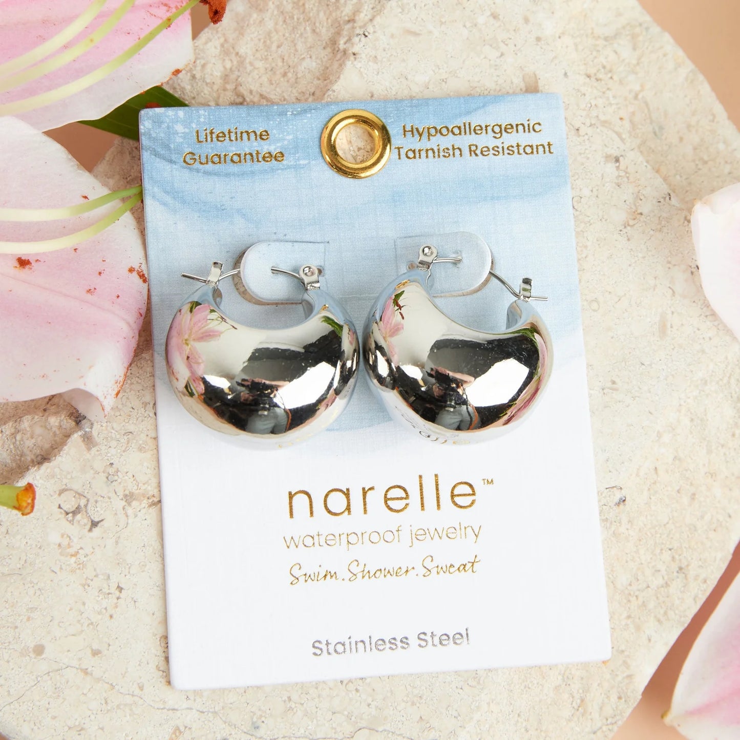 silver Narelle Waterproof Bowl Hoop Earrings on their card packaging