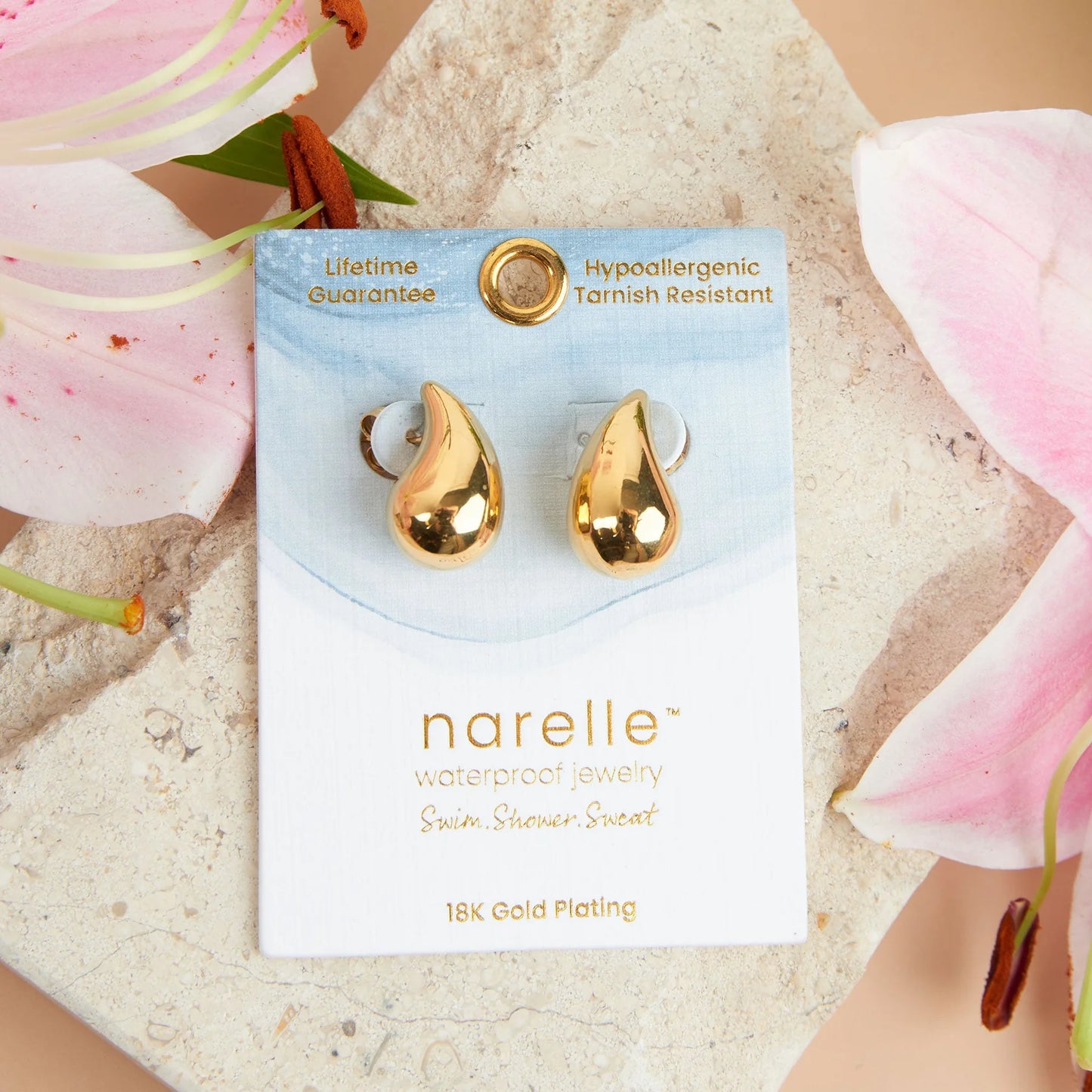 gold Narelle Waterproof Tear Drop Earrings on their card packaging