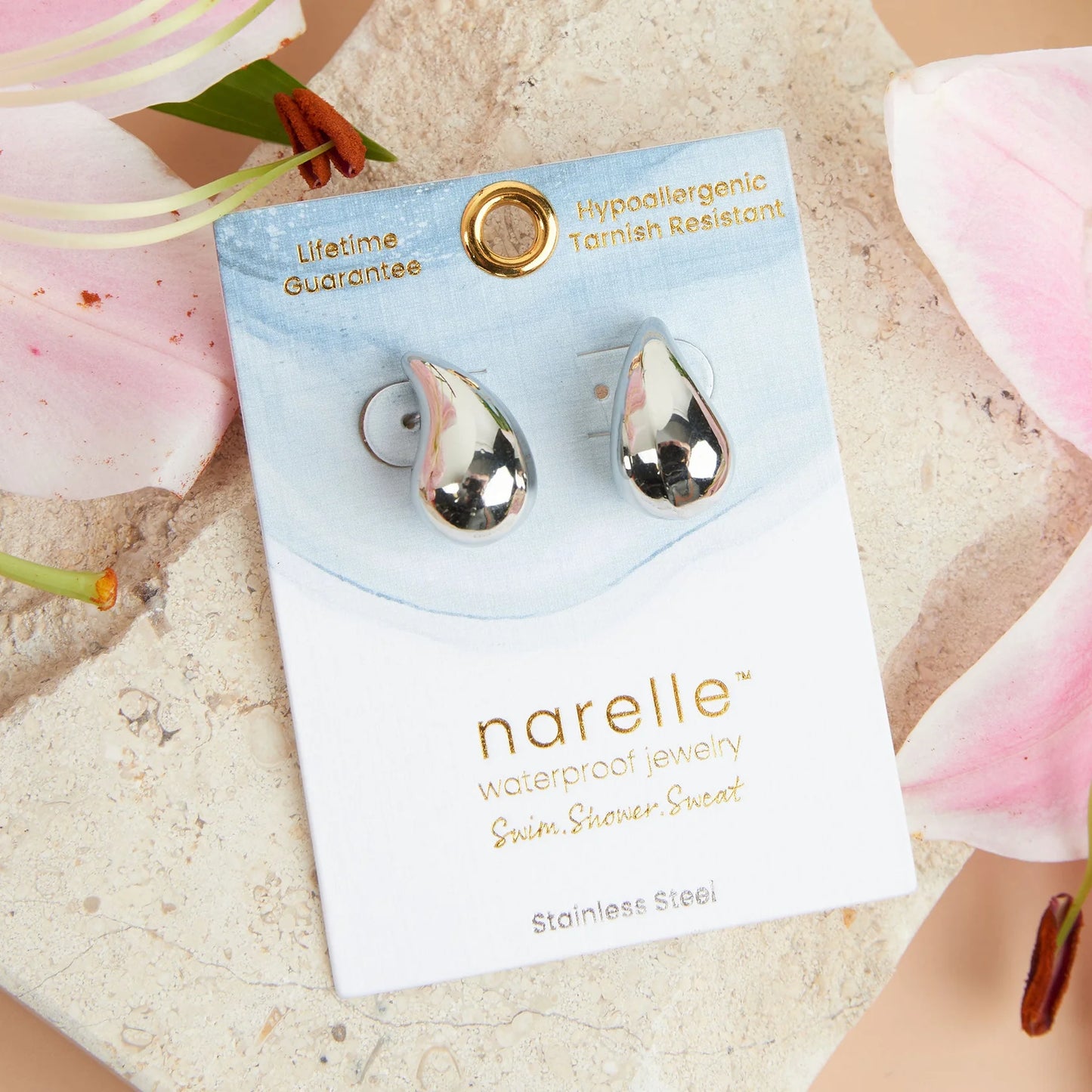 silver Narelle Waterproof Tear Drop Earrings on their card packaging