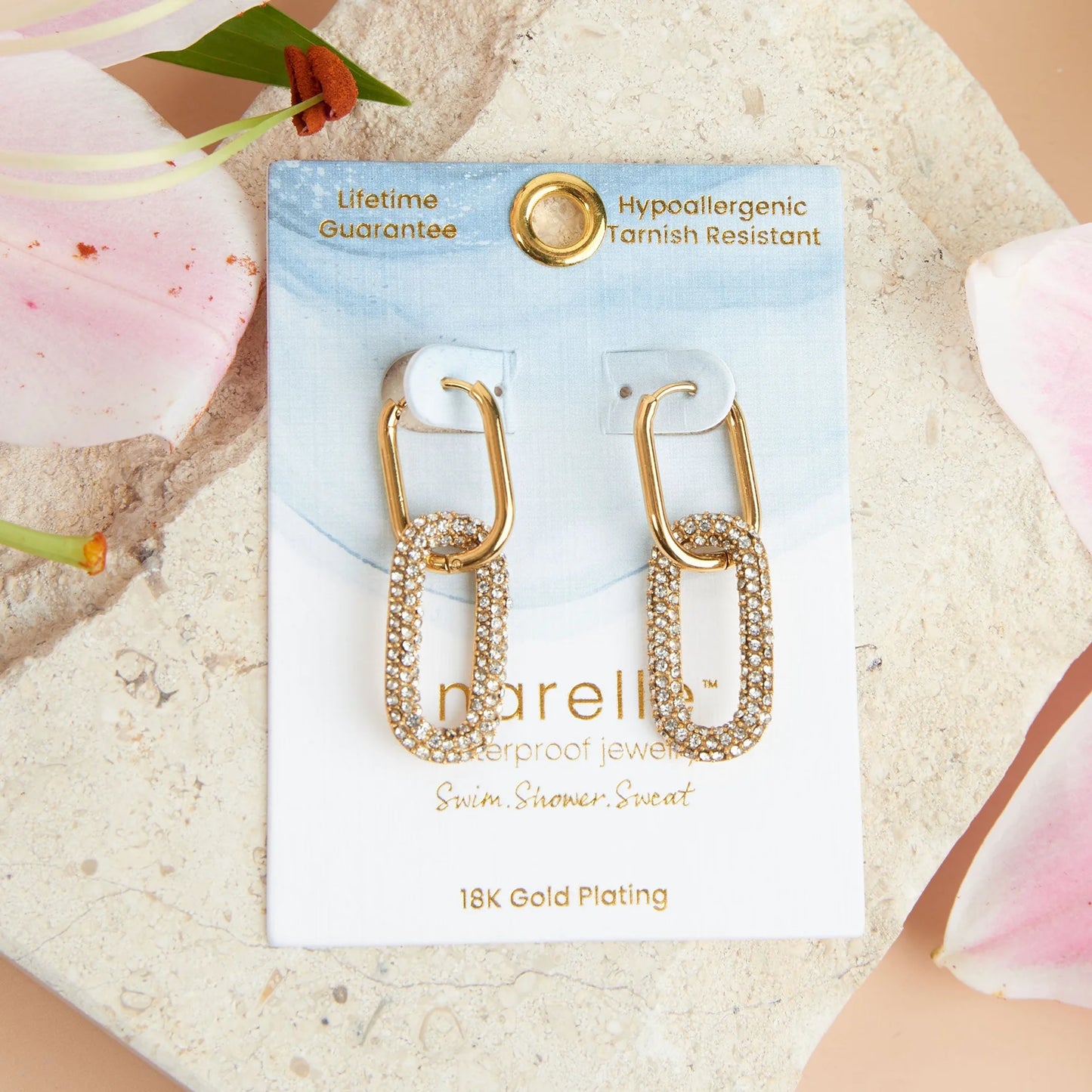 gold Narelle Waterproof Pave Linked Hoop Earrings on their card packaging