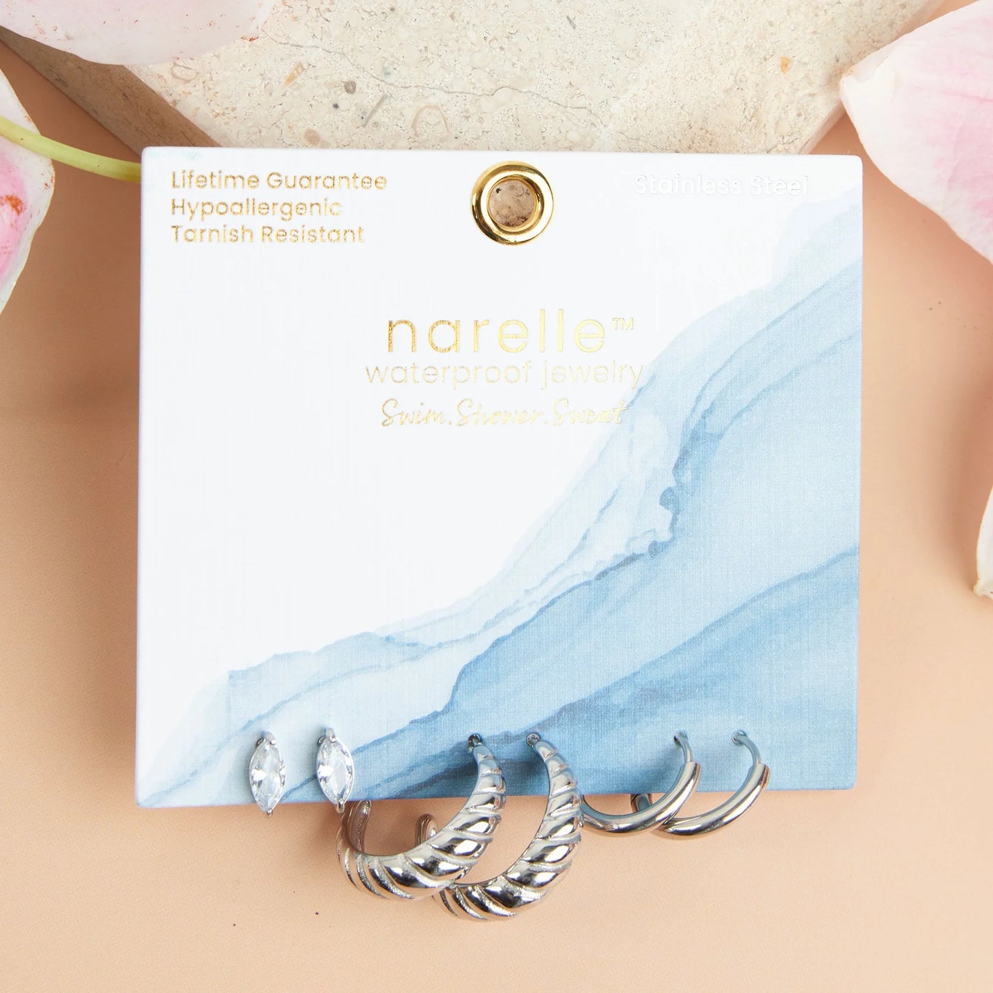 silver Waterproof Half Moon Hoop Earring Trio on their card packaging
