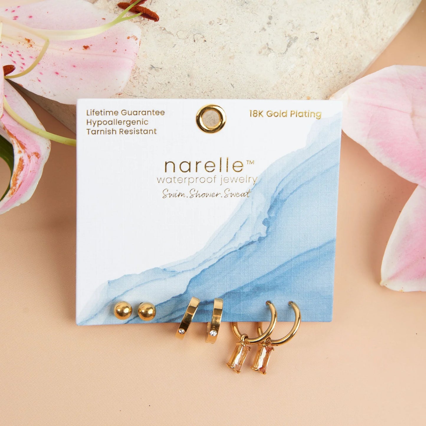 gold Waterproof Charm Hoop Earring Trio on its card packaging