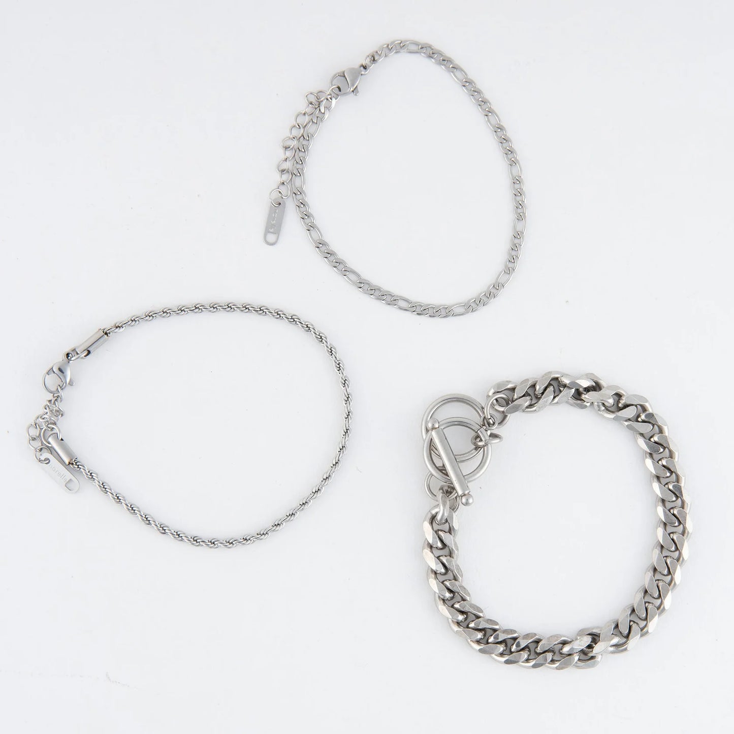 silver Waterproof Figaro Chain Bracelet Set laying flat on a white background