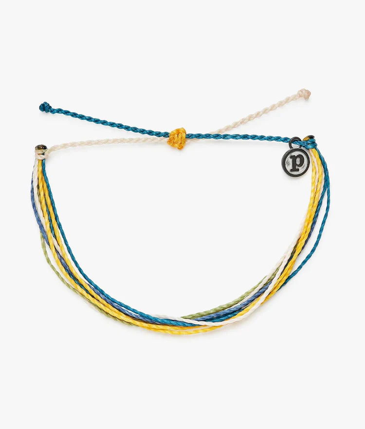 Pura Vida multi strand corded bracelet in varying shades of blue, yellow, green, and white with a Pura Vida logo charm