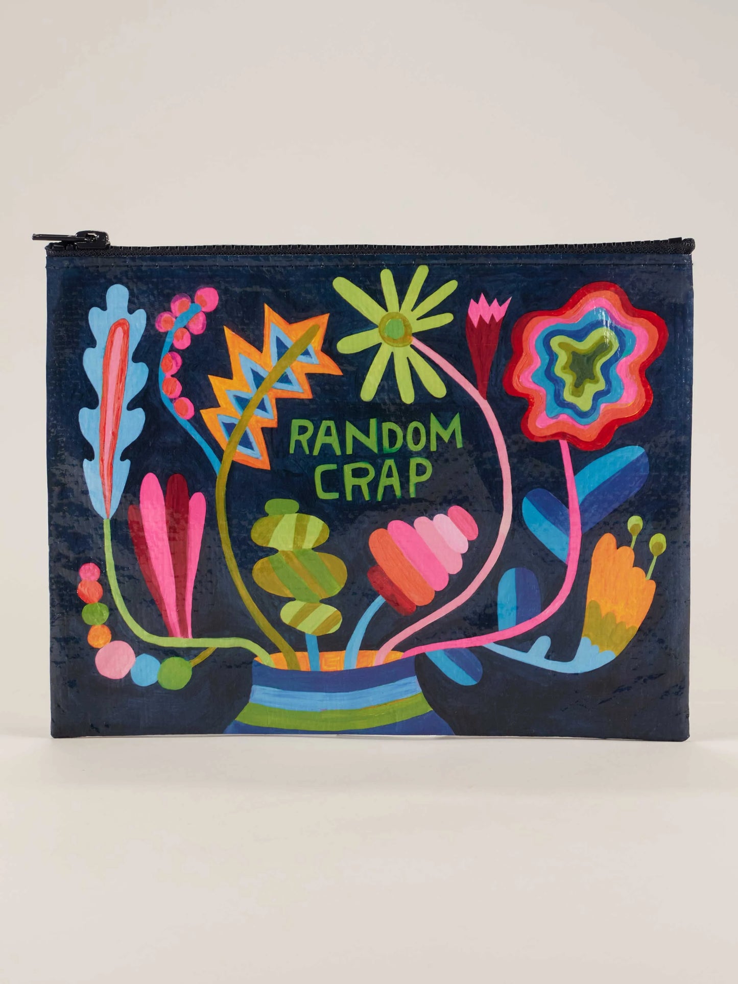 navy blue zipper pouch with colorful floral pattern and "random crap" printed on it.