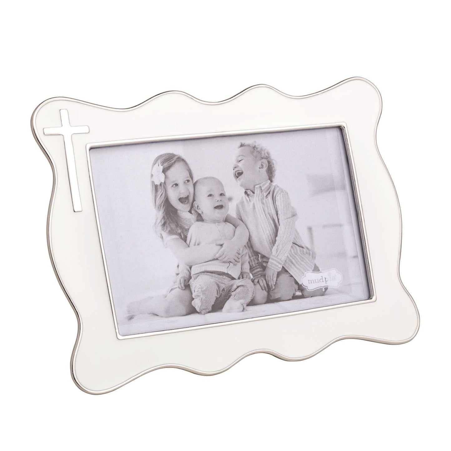White decorative photo frame with silver cross on it and a family photo inside on a white background