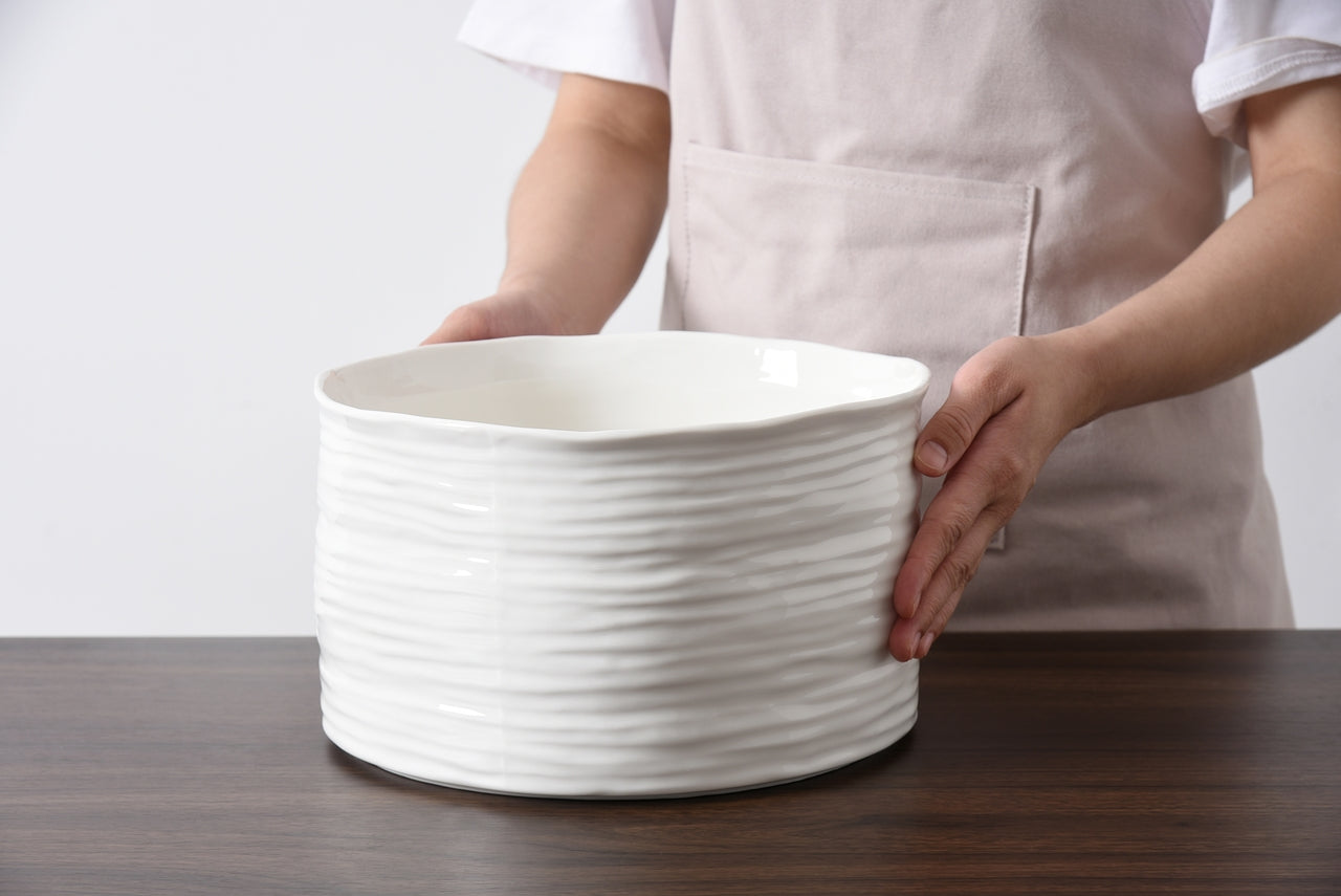 person holding the le blank large bowl