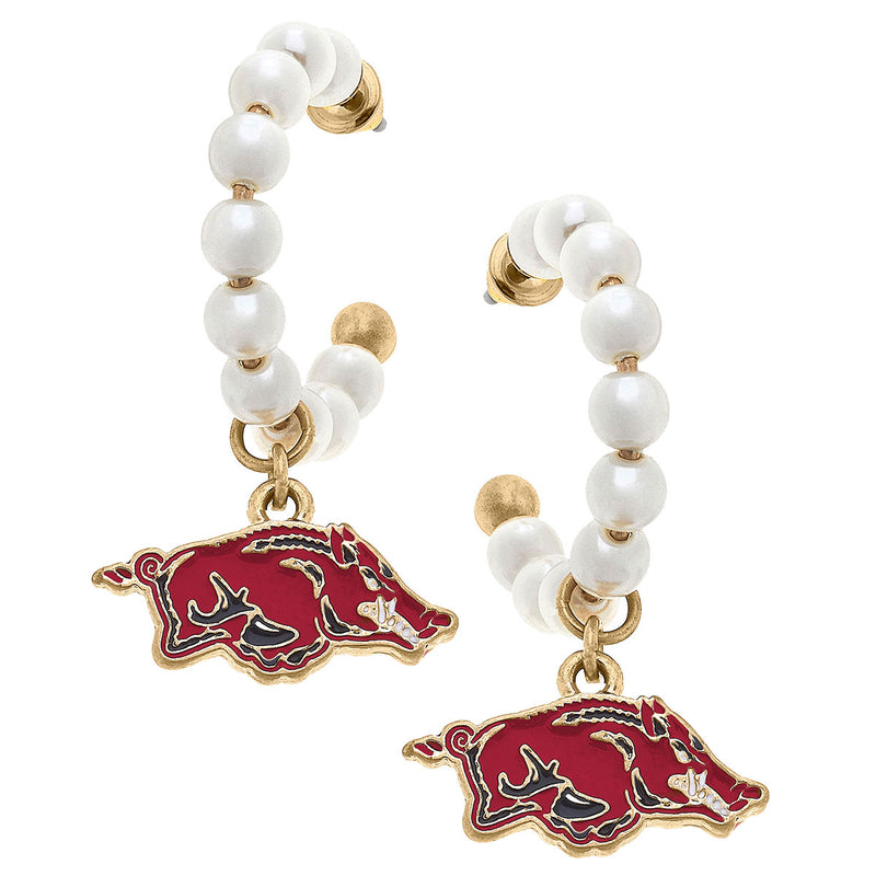 pearl hoops with an enamel razorback pendent hanging from them shown on a white background.