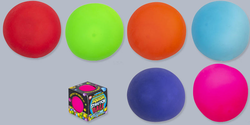 Colorful stretch balls and their packaging on a gray background