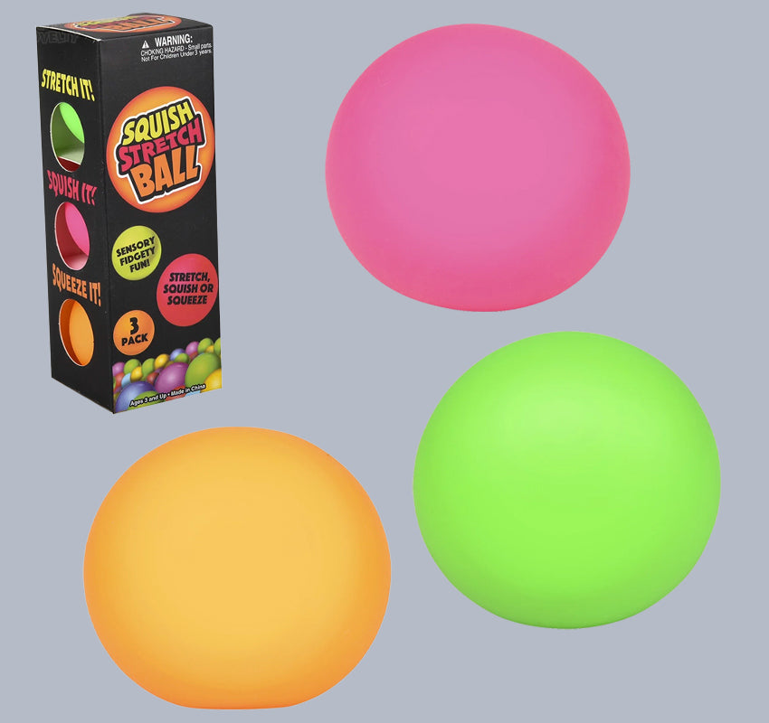 Pink, orange, and green stretch balls with packaging on a gray background
