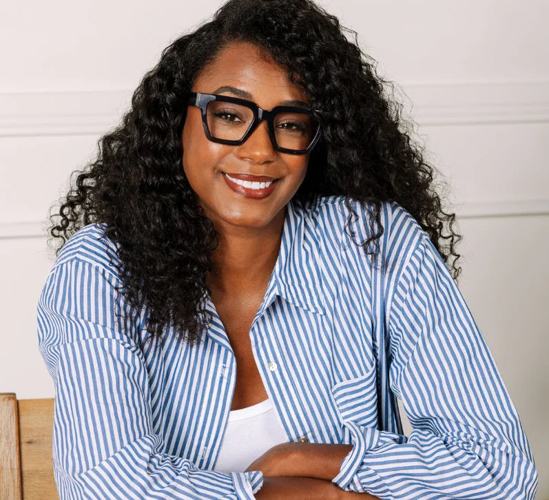 person wearing Take a Bow glasses in navy