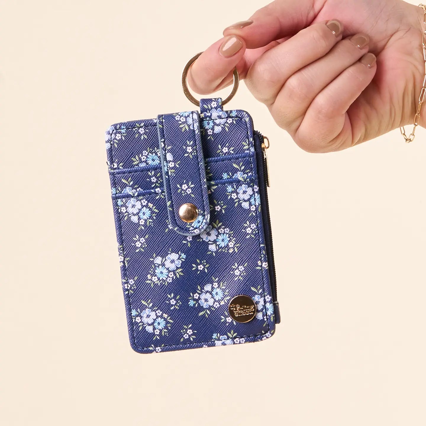 hand holding Endless Daydream Keychain Card Wallet by the key ring