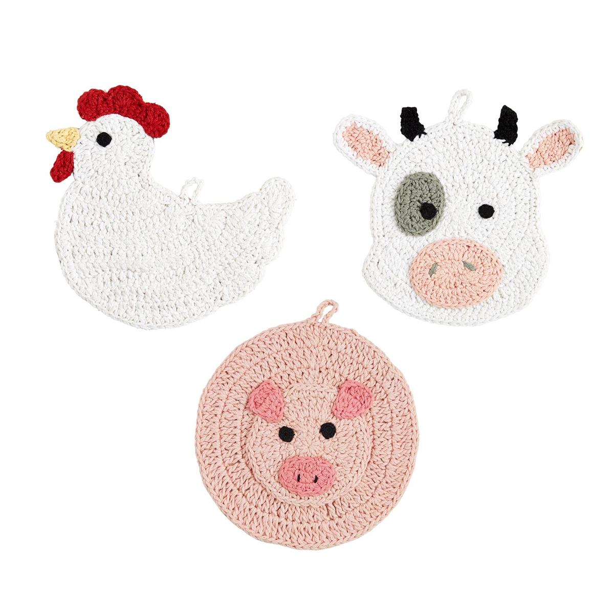 rooster, cow, and pig crocheted trivets on a white background.