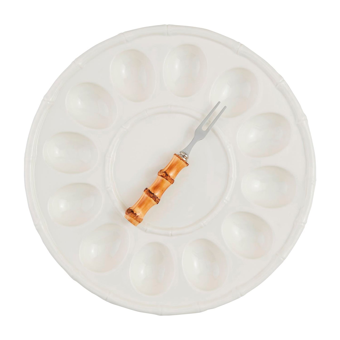 A white bamboo deviled egg tray set with a bamboo-handled fork on a white background.