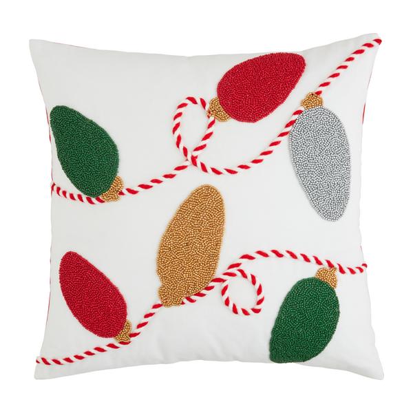 beaded string of christmas light in red, green, gold, and silver on a white pillow