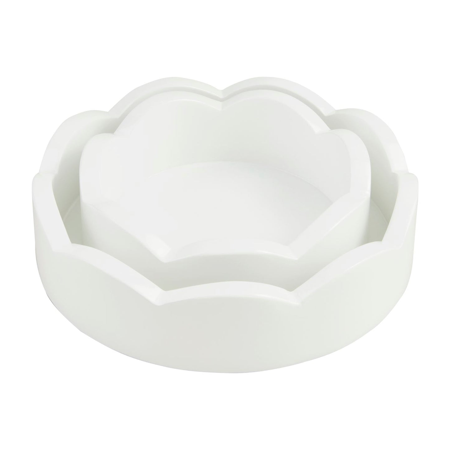 Two sizes of round white scalloped edge trays nested together.