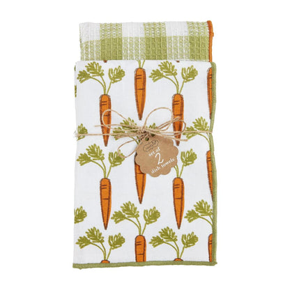 carrot towel set tied together with twine, top towel is white with carrot pattern printed on it, waffle weave towel has a green check pattern.