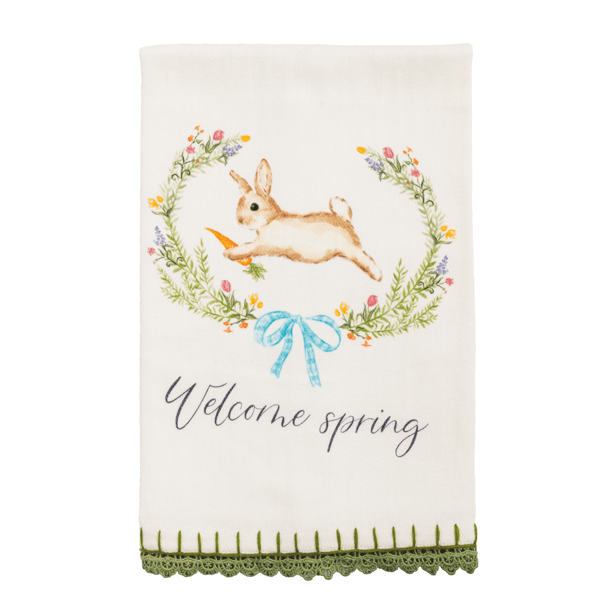 white towel with a bunny and floral wreath design, green trim and the text 'Welcome spring'.