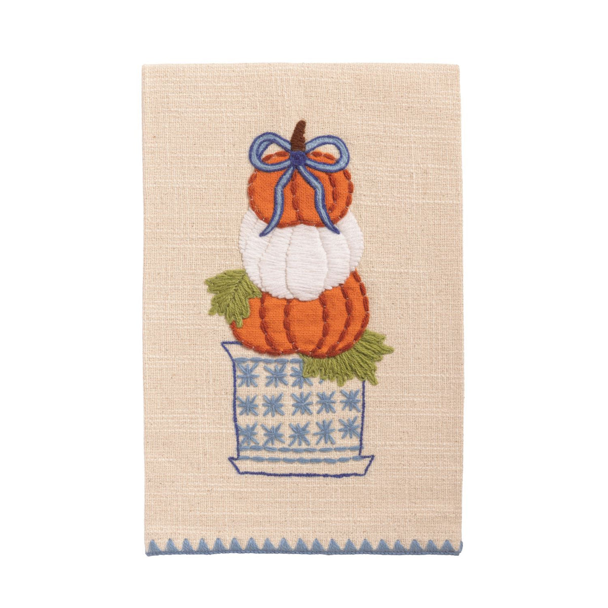 Decorative towel with embroidered pumpkin stack and a bow on a beige background