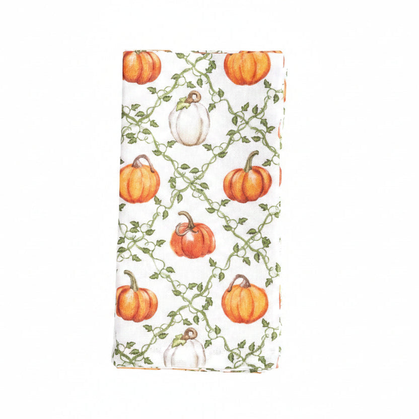 folded pumpkin vine cloth napkins shown on a white background
