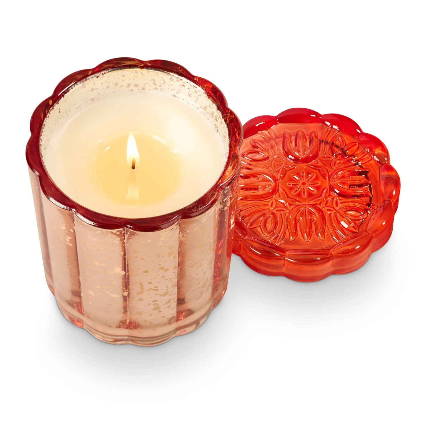 lit Blood Orange Dahlia Flourish Glass Candle with lid set to the side