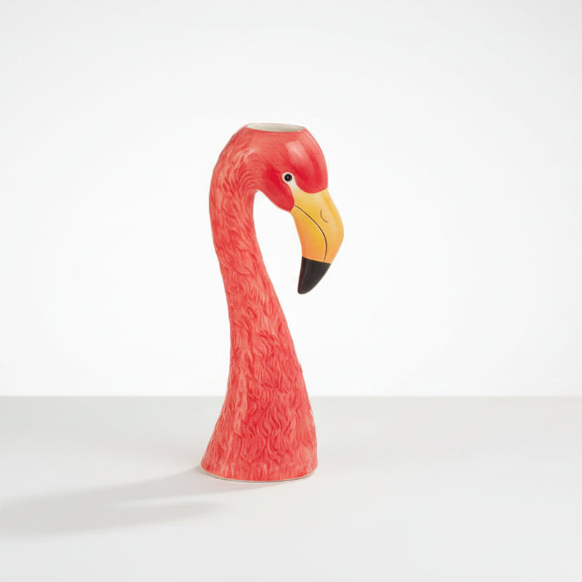 bright pink Flamingo-shaped vase on a light background