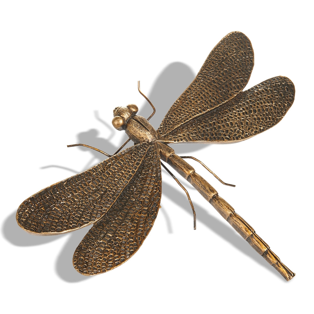 antique gold dragonfly on a white background