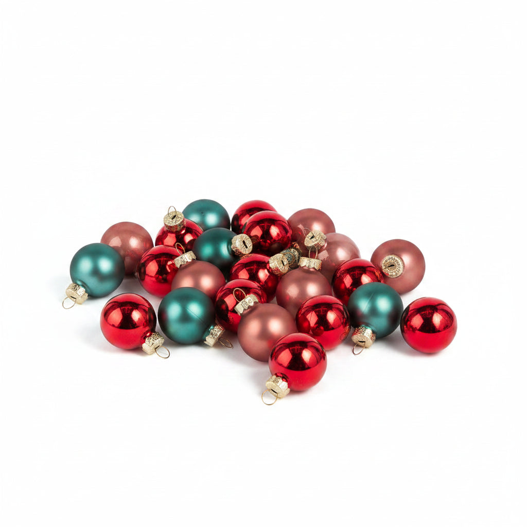 small glass ball ornaments in red, green, and pink in a cluster on a white background
