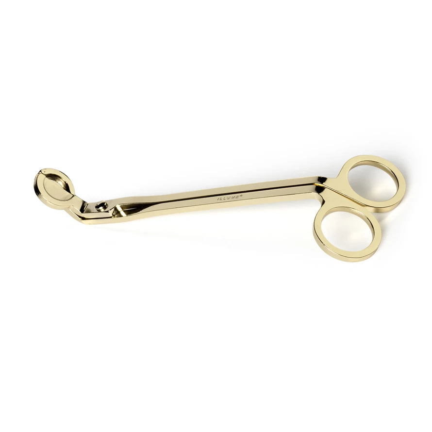 gold candle wick trimmers on a white background.