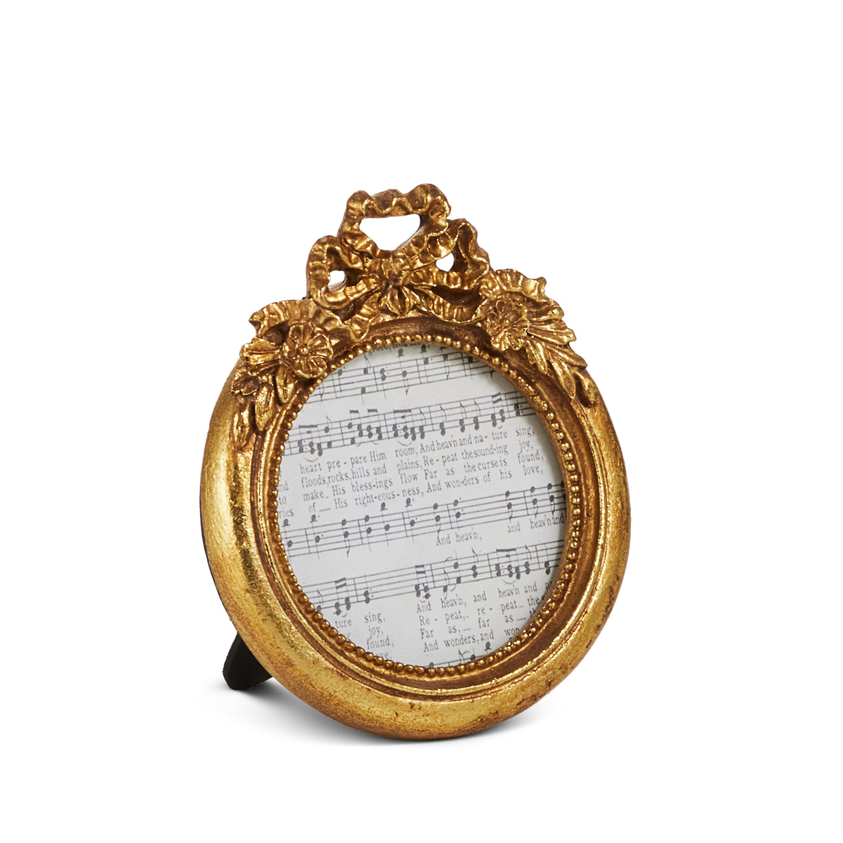circular gold frame with a bow and flowers at the top on a white background