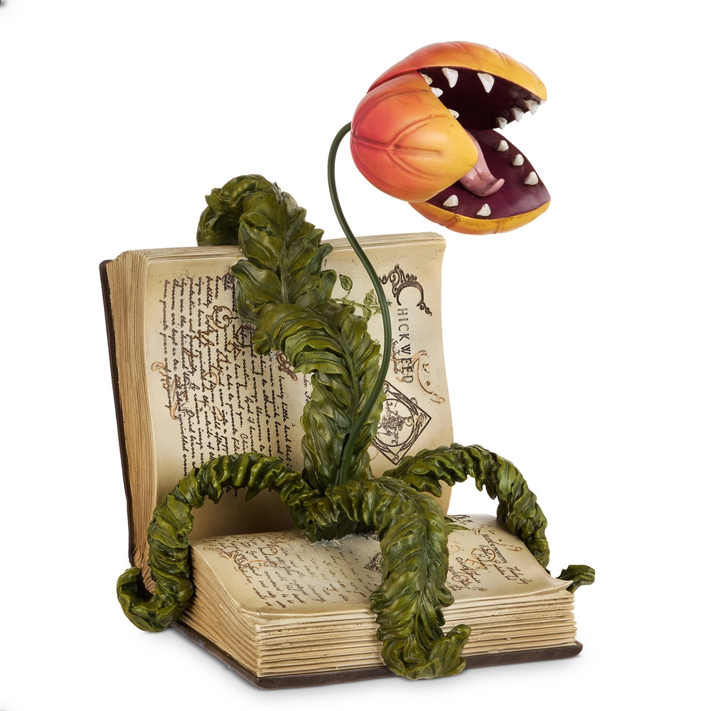 artificial open book with stylized venus flytrap on it