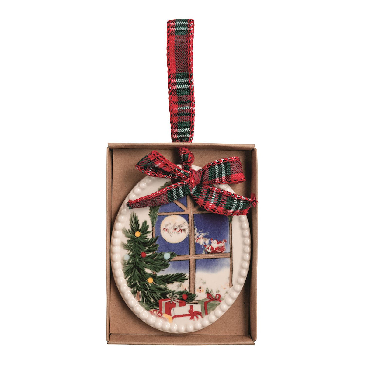 Decorative Christmas ornament with a window scene of santa flying in his sleigh in a box packaging