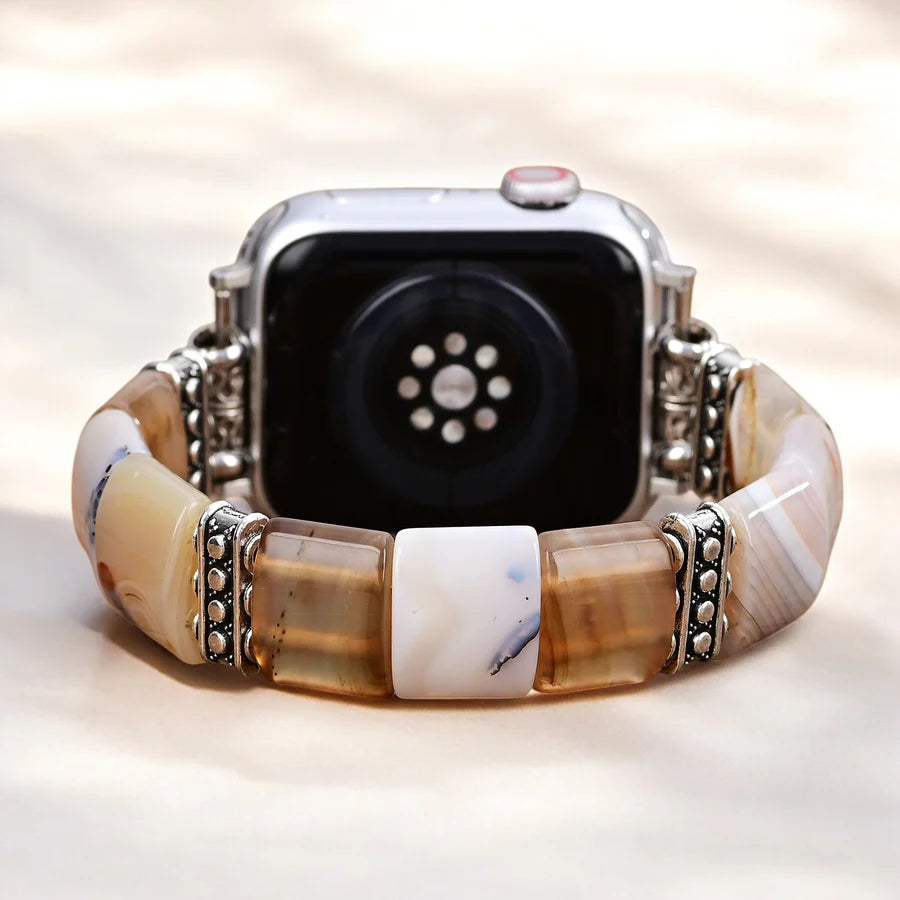 back view of Smartwatch with a decorative band on a light background