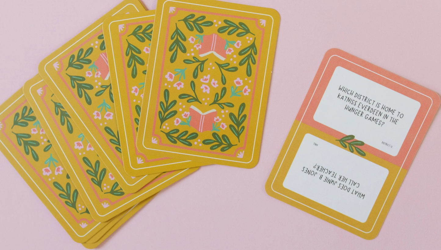 several card fanned out with one card showing trivia question about the hinger games.