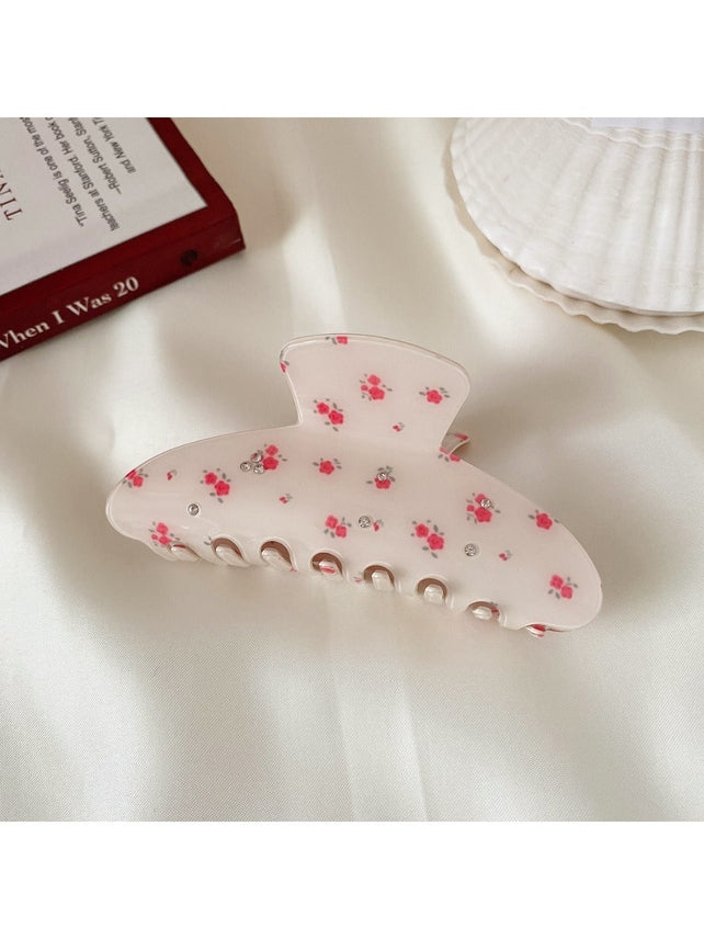 Flowers & Rhinestones Claw Clip on a desk