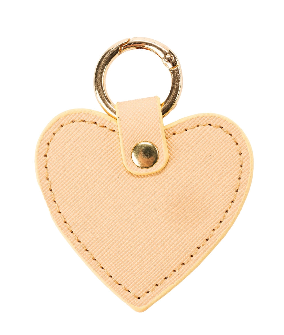 heart shaped J’Adore Beige Bag Charm with gold o-ring