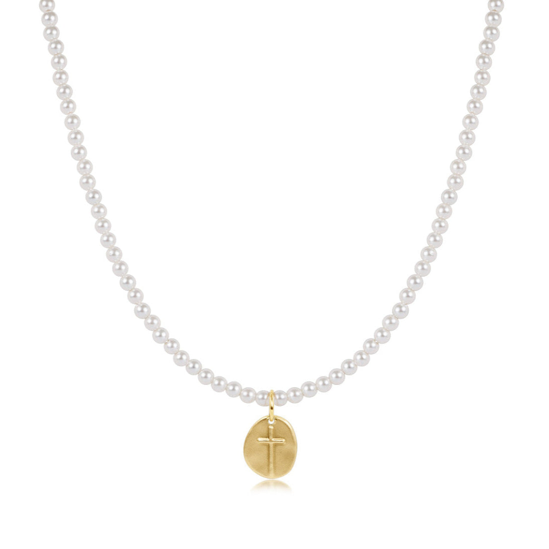 pearl necklace with gold cross charm