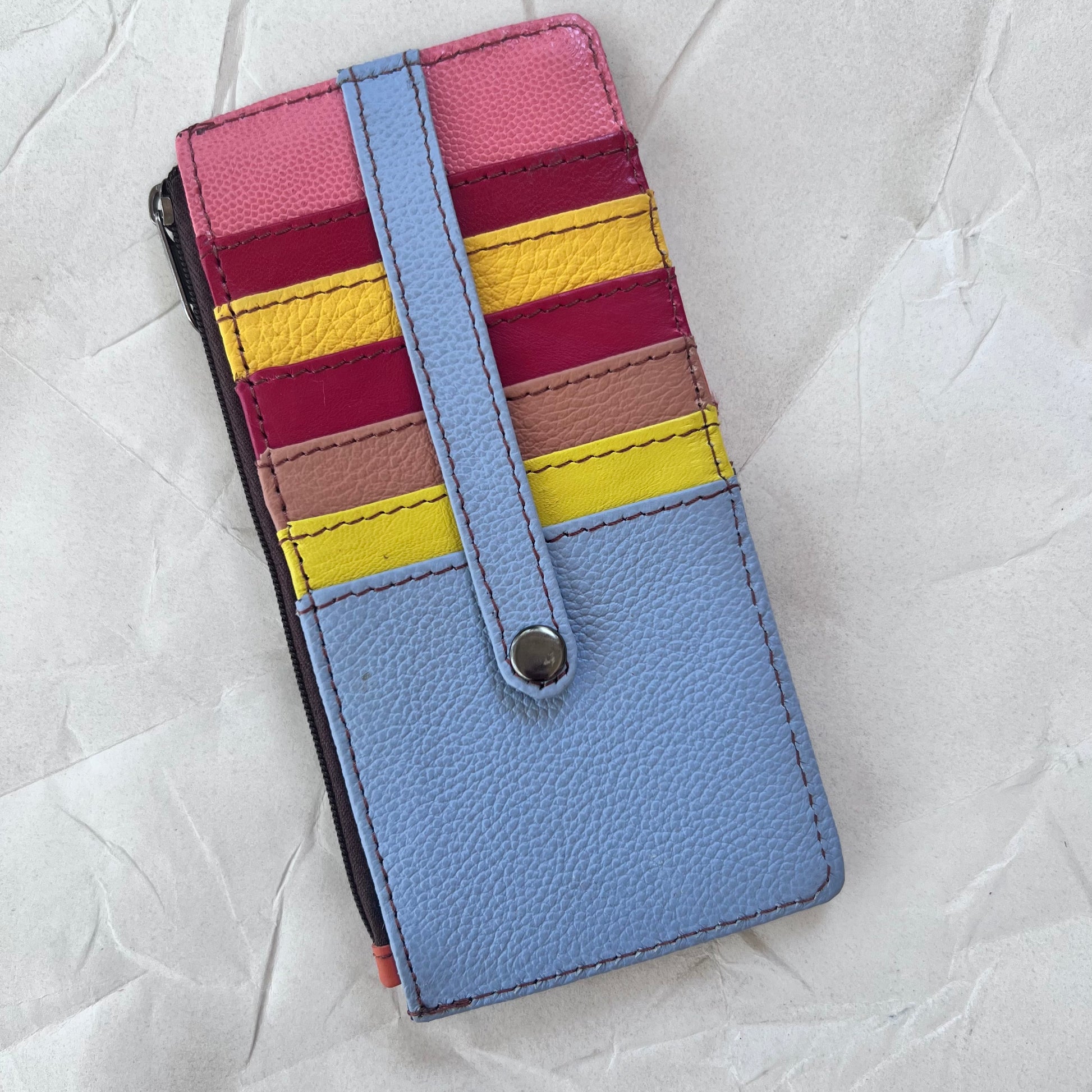 cassie card holder with yellow, pinks, red and blue card slots.