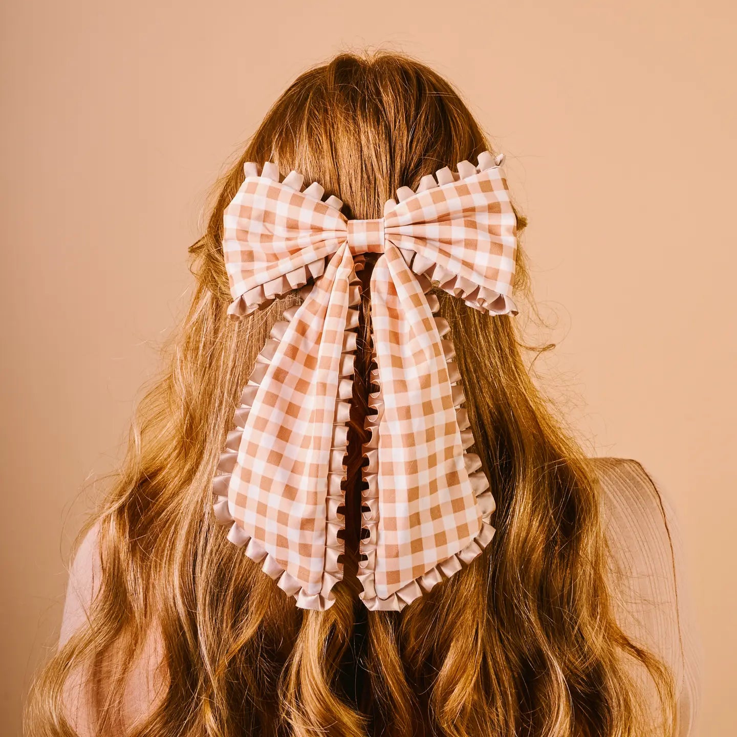 back view of person's head wearing maple gingham Fancy Frills Hair Bow