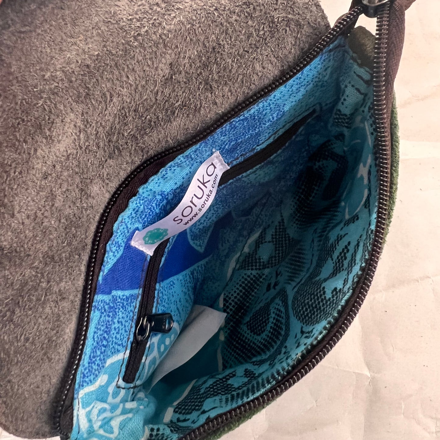 interior of bag showing inner zipper pocket.