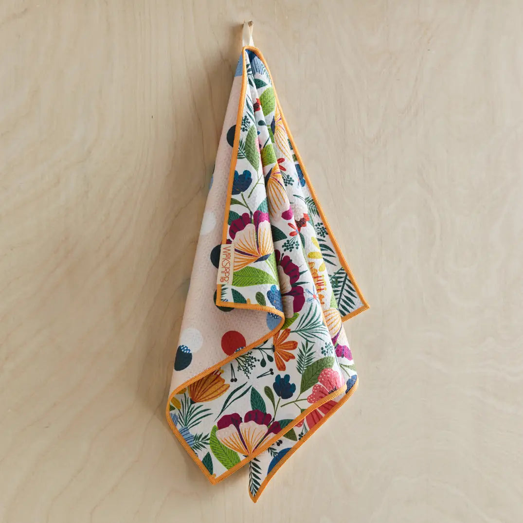 Fields Of Flowers Microfiber Dishtowel hanging on a hook