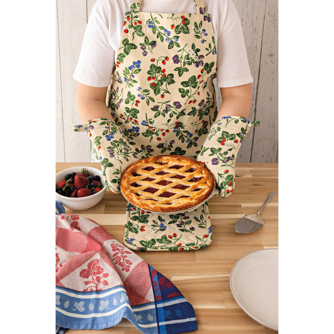 a person wearing a berry bramble apron