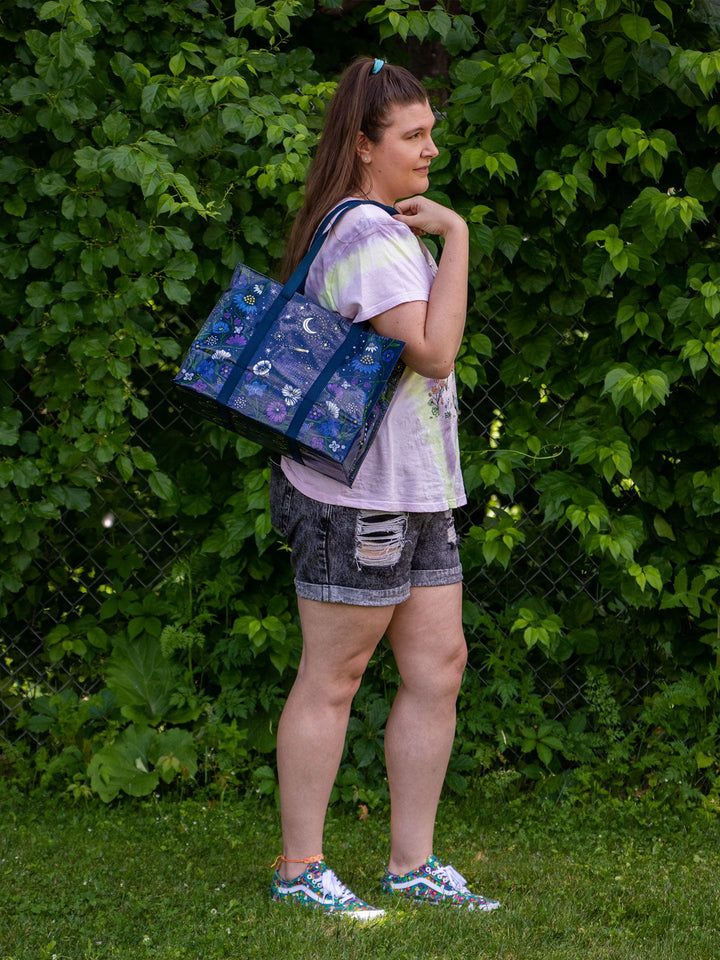 person in a park carrying Starry Garden Shoulder Tote