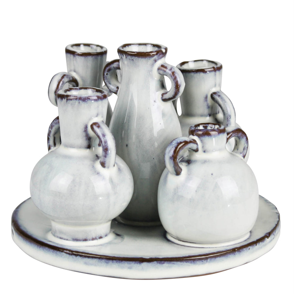5 small vases attached to a base
