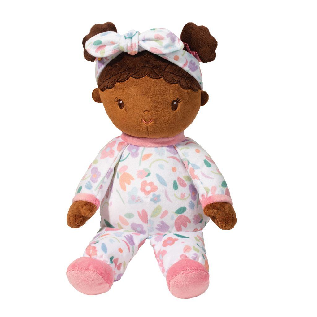 Lola Blossom Doll seated on a white background.