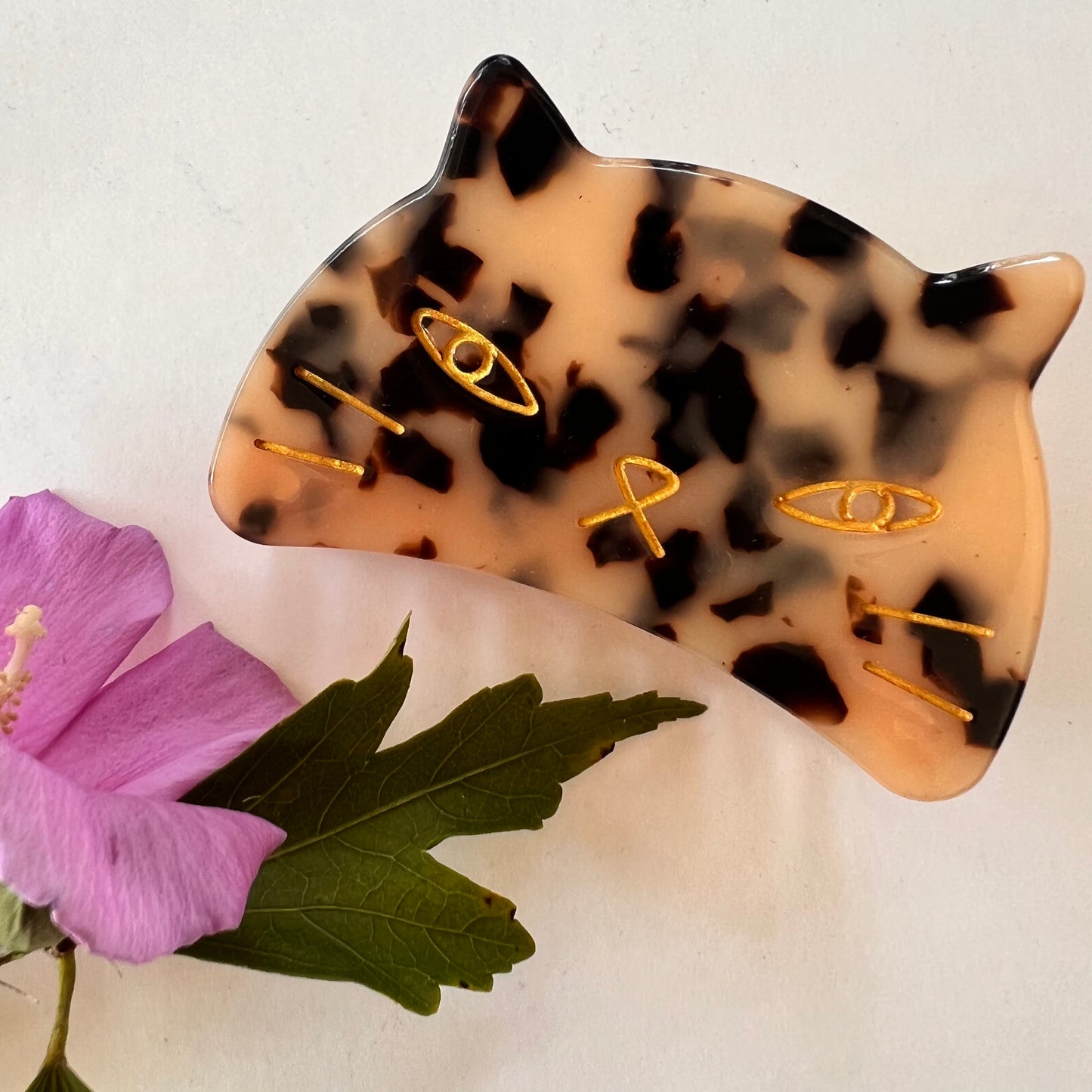Tokyo cat face hair clip.