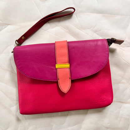 saddle bag with wristlet strap attached.