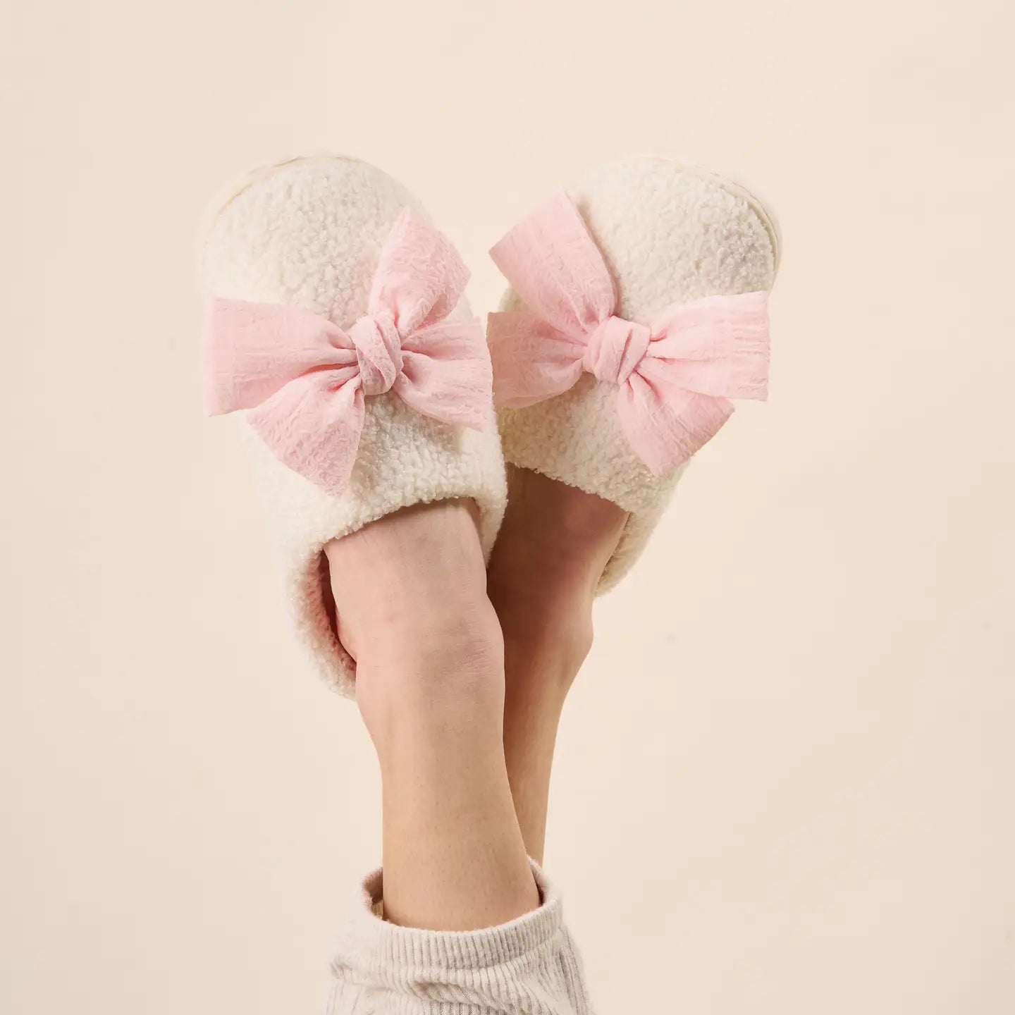 feet wearing Blush Betty Bow slippers